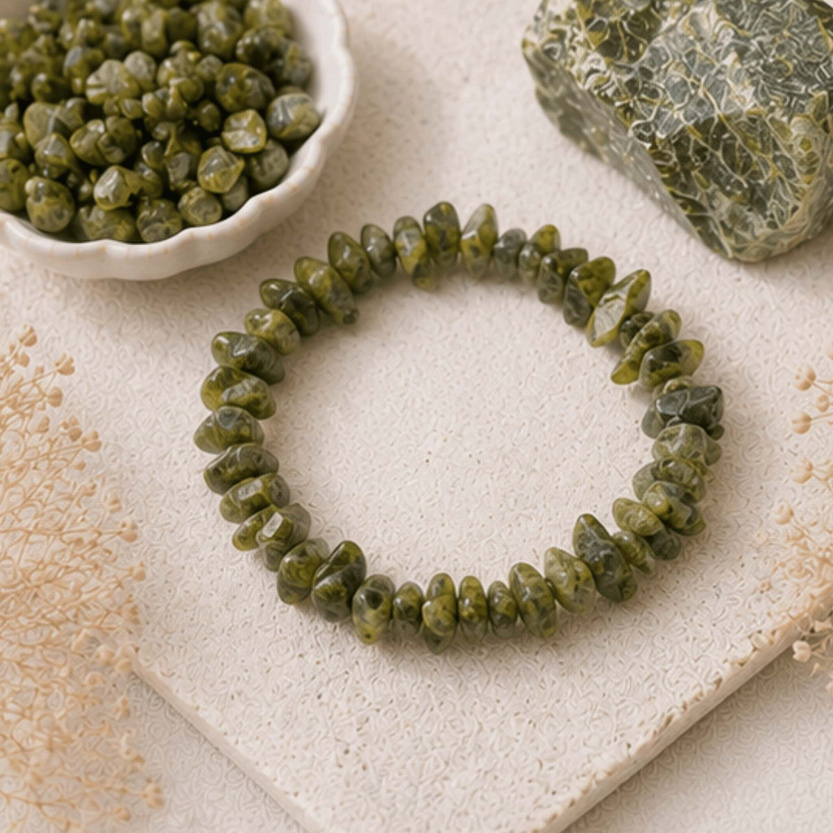 Serpentine crystal jewelry collection with green detoxifying healing stone. Serpentine bracelets