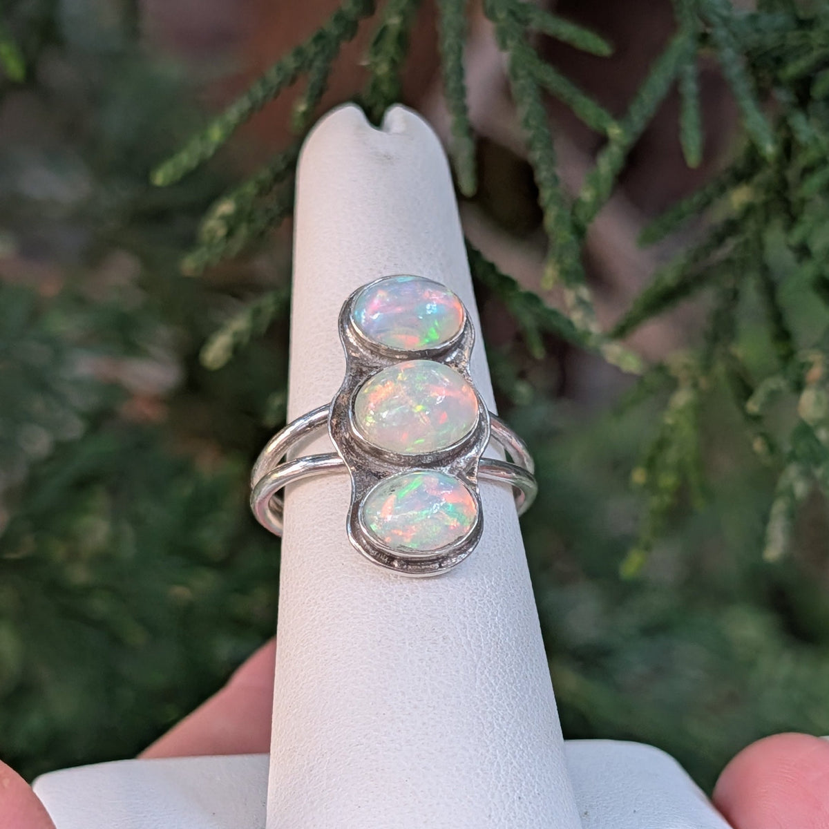Side view of the Three Fates ring’s split silver band