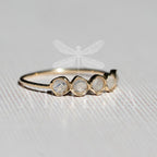 Close-up of a natural moonstone set in yellow gold