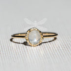 Moonstone solitaire ring in 14K yellow gold with diamond accents