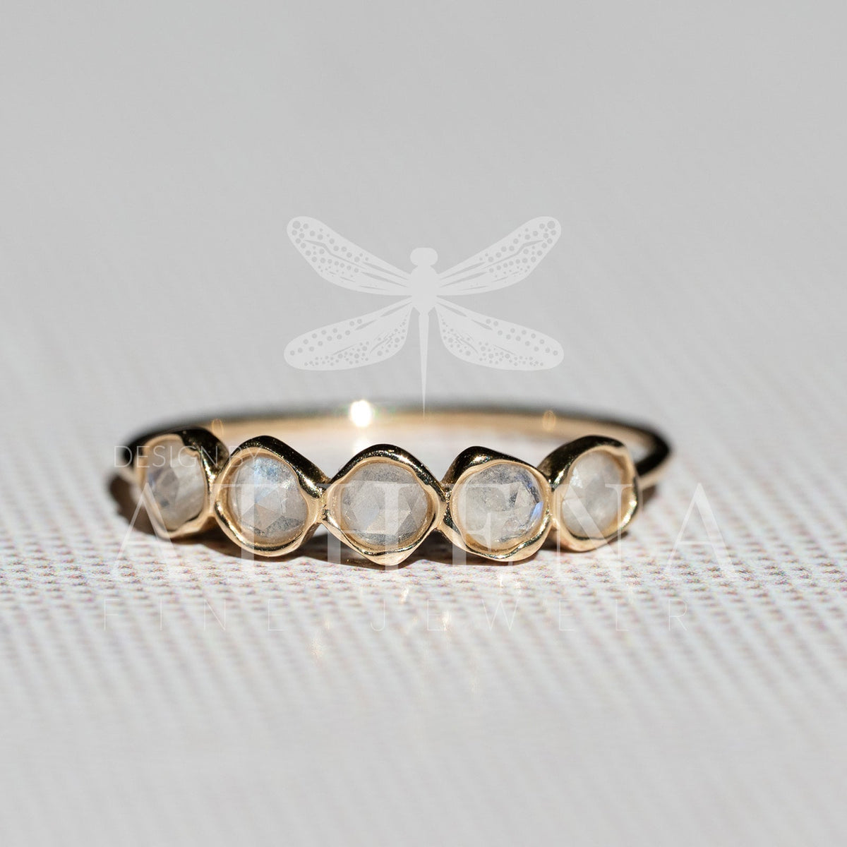 Moonstone ring with a rounded 14K yellow gold band