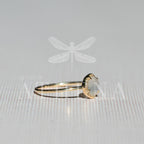 Moonstone and diamond ring in a 14K yellow gold setting