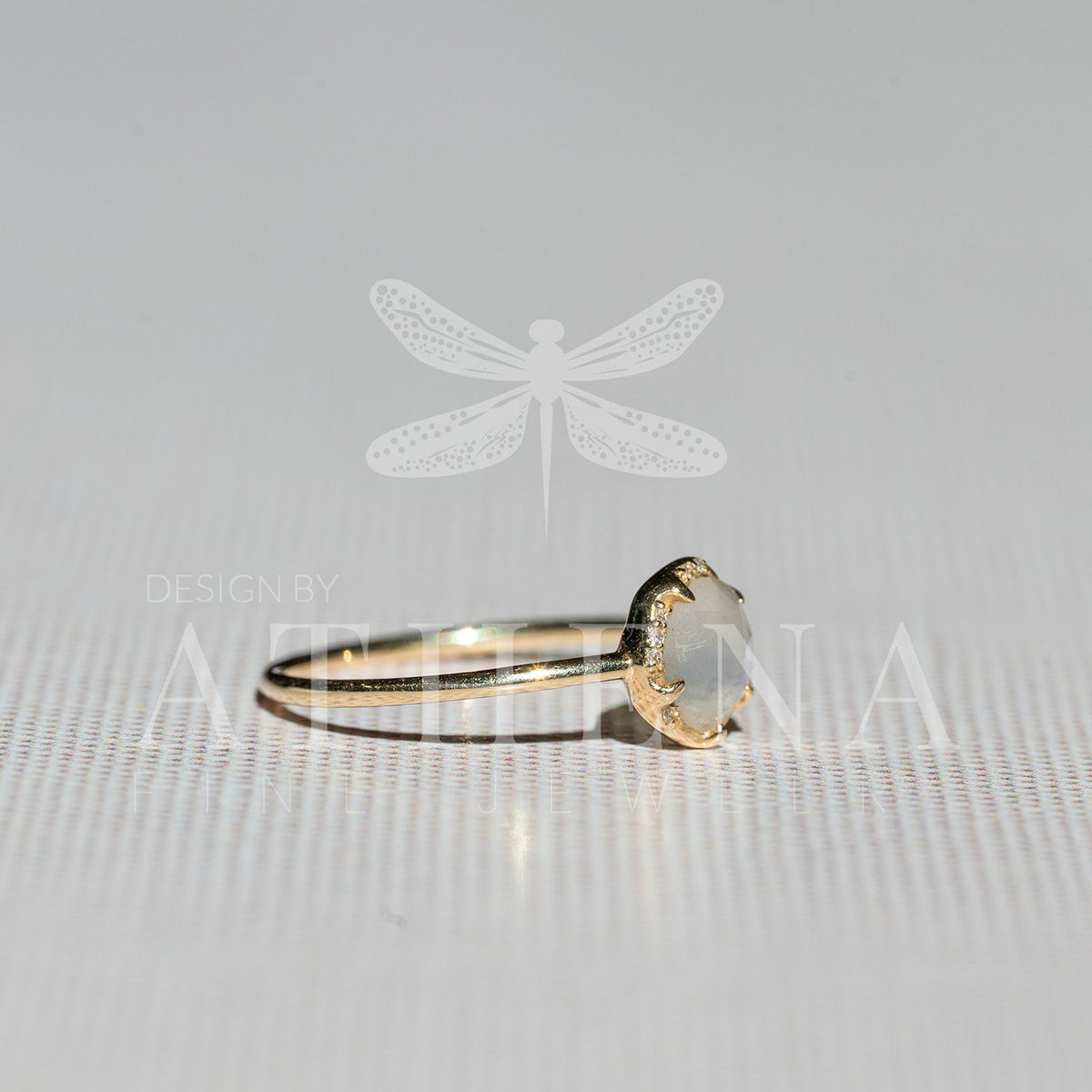 Moonstone and diamond ring in a 14K yellow gold setting