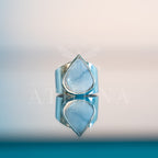 Sky ring with a light blue opal and wide silver band