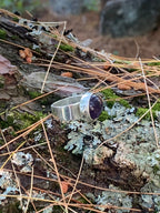 Close-up of a natural amethyst cabochon in silver