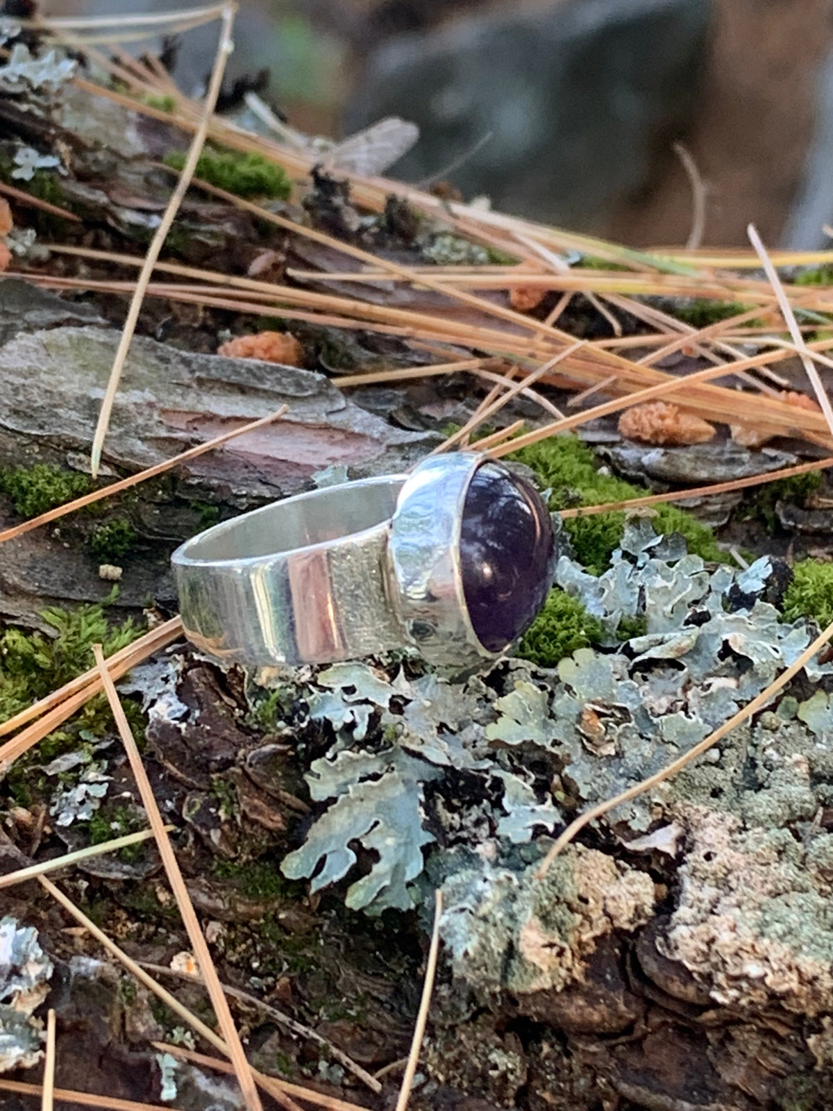 Side view of the Dionysus ring’s smooth sterling silver band