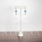 Unpolished turquoise stones in sterling silver earrings