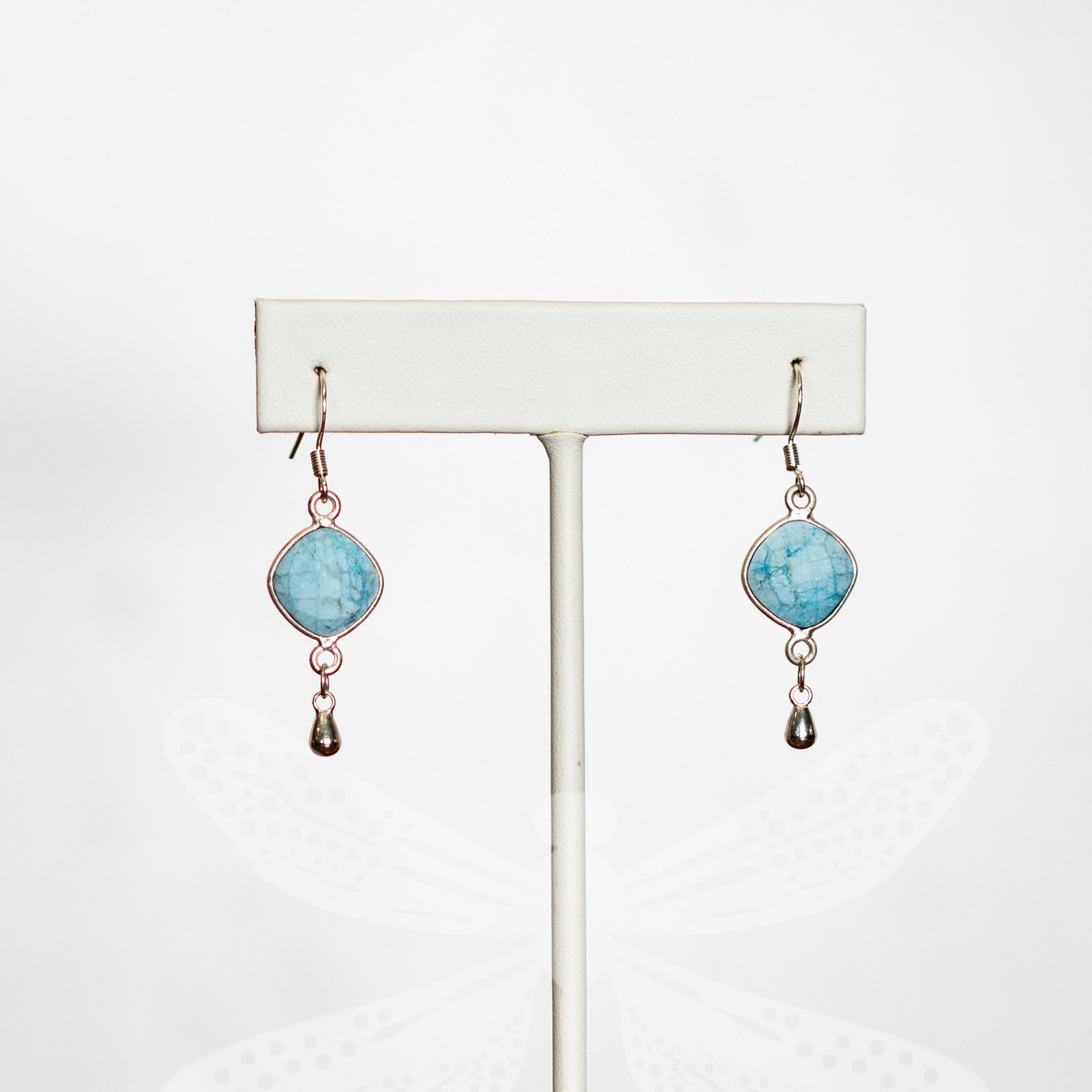 Raw turquoise earrings with blue-green stones and sterling silver lever backs