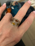 Honey and golden Baltic amber ring with curved silver setting