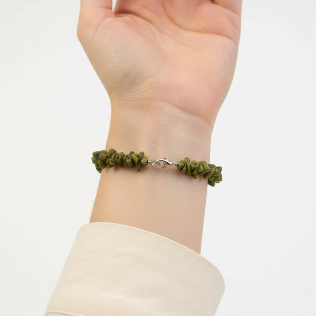 Serpentine crystal bracelet on wrist – heart chakra healing bracelet for emotional balance and growth