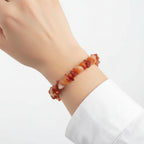 Carnelian crystal bracelet on wrist – sacral chakra bracelet for motivation, strength and creative energy