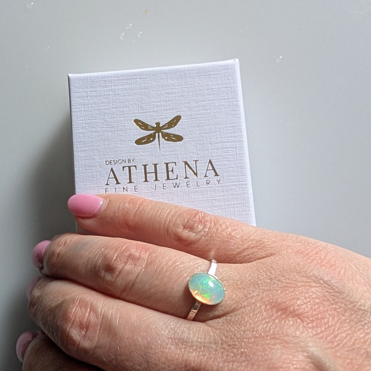 Oval fire opal ring with a balanced sterling silver band