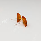 Close-up of golden Baltic amber triangular cabochons
