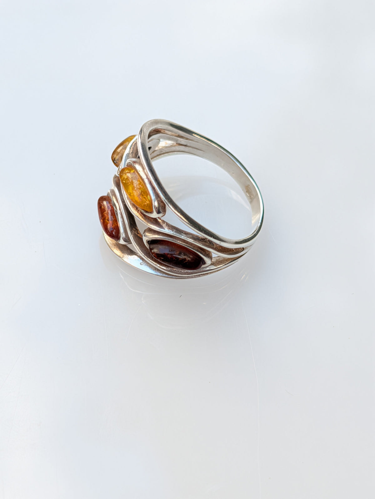 Three-stone Baltic amber ring in handcrafted sterling silver