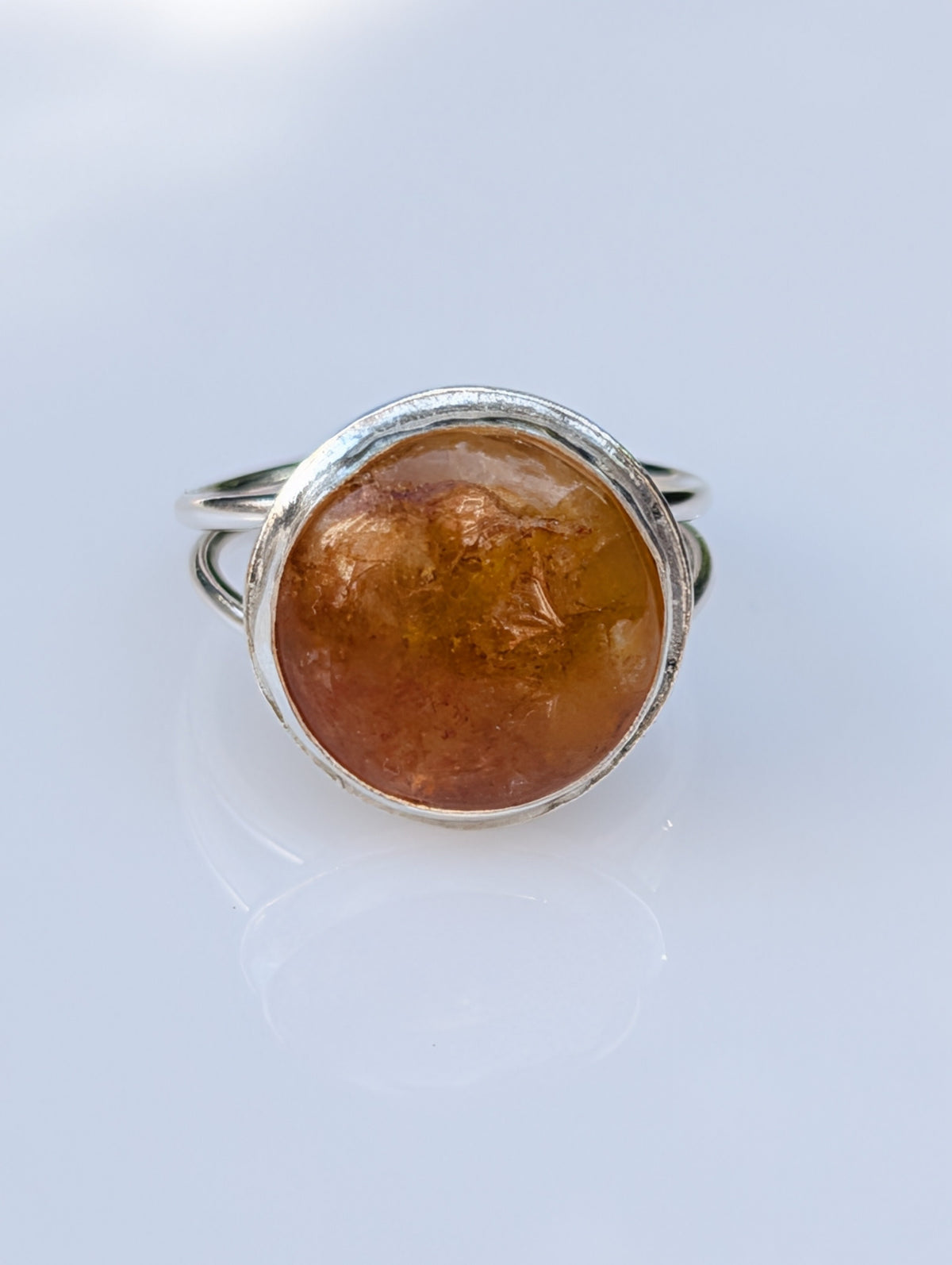 Forge statement ring showing its textured silver finish
