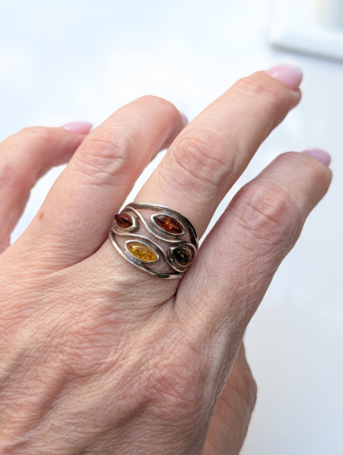 Sterling silver statement ring with three marquise Baltic amber stones