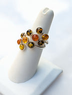 Natural Baltic amber ring with varied colors and inclusions