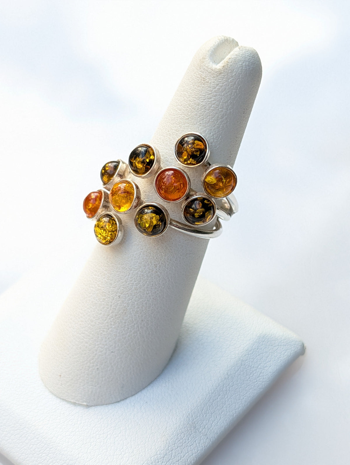 Natural Baltic amber ring with varied colors and inclusions
