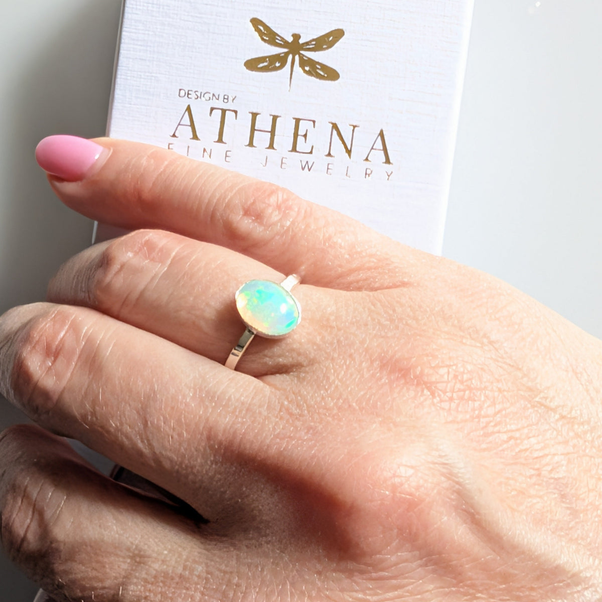 Fire opal cabochon ring showing flashes of green