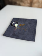 Low-profile fire opal ring with a smooth silver band